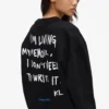 Avslappet sweatshirt med Karl-sitat