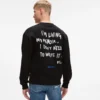 Avslappet sweatshirt med Karl-sitat