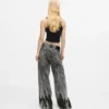 Bleket lavt sittende jeans med vid ben