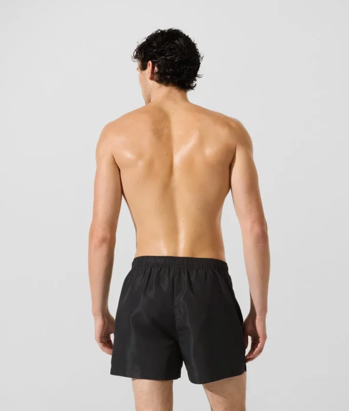 Ikon metalliske boardshorts