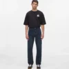 Jeans med monogram over hele