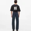 Jeans med monogram over hele