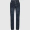 Jeans med monogram over hele