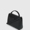 K/Autograph veske med pigger og håndtak på toppen