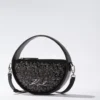 K/Signature rund crossbody-veske med paljetter