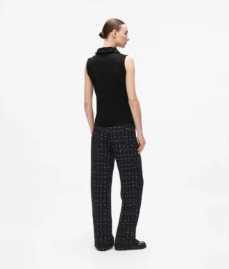 Polo med bouclé-detaljer