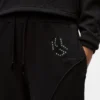 Sweatpants med monogram og nitter