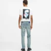 Tapered jeans med malingssprut