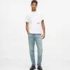 Tapered jeans med malingssprut