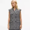 Tweedvest med paljettrevers
