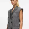Tweedvest med paljettrevers