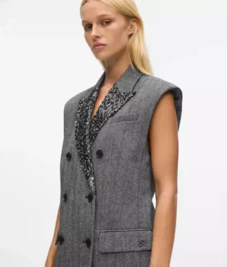 Tweedvest med paljettrevers