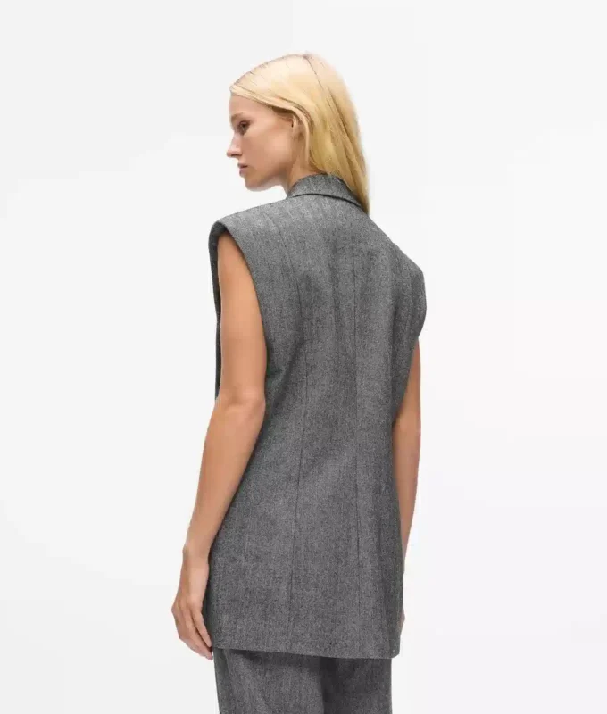 Tweedvest med paljettrevers